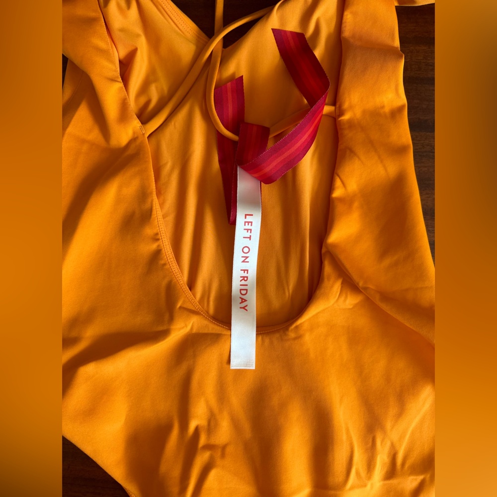 Left on Friday: Large Tall, marigold color, weekender suit